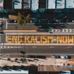 A powerful aerial shot of the 'End Racism Now' mural painted on a street in Philadelphia, promoting racial equality.